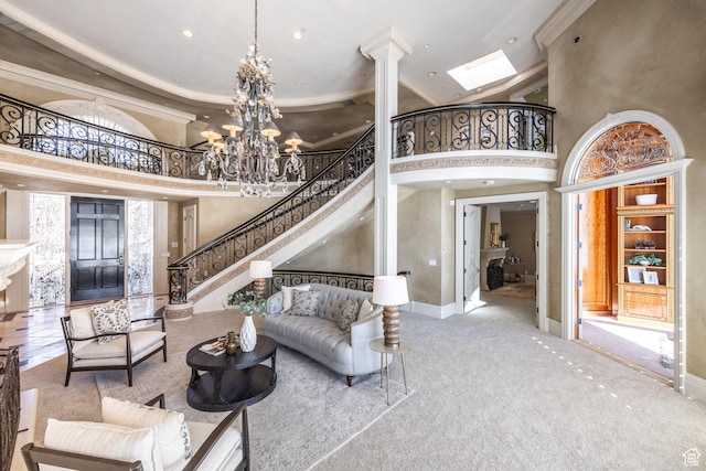 2726 E Wasatch Dr Unit 18, Salt Lake City, UT 84108 - carpeted living room featuring baseboards, a notable chandelier, a high ceiling, and stairway