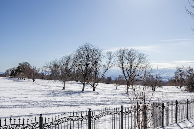 2726 E Wasatch Dr Unit 18, Salt Lake City, UT 84108 - yard layered in snow featuring fence
