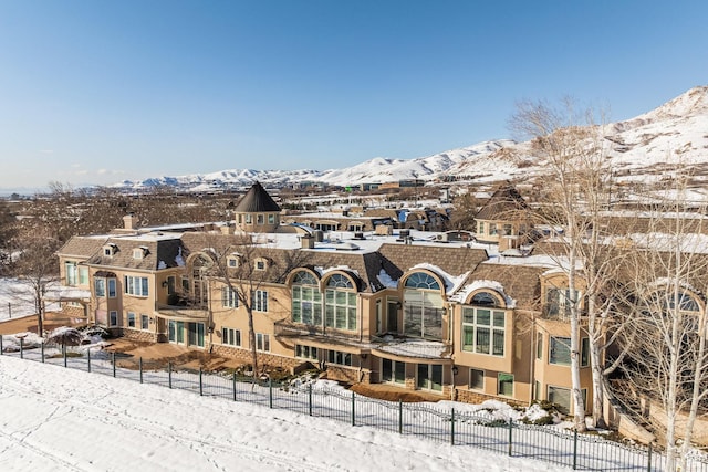 2726 E Wasatch Dr Unit 18, Salt Lake City, UT 84108 - snow covered property with fence and a mountain view