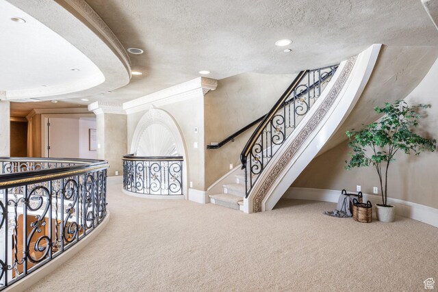 2726 E Wasatch Dr Unit 18, Salt Lake City, UT 84108 - interior space with crown molding, recessed lighting, carpet, baseboards, and a textured ceiling