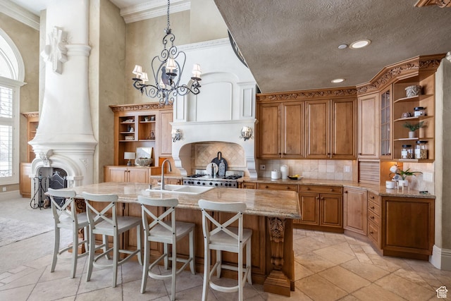 2726 E Wasatch Dr Unit 18, Salt Lake City, UT 84108 - kitchen featuring light stone countertops, a sink, open shelves, and brown cabinetry