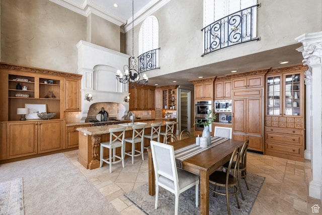 2726 E Wasatch Dr Unit 18, Salt Lake City, UT 84108 - dining area featuring a high ceiling, an inviting chandelier, crown molding, and a healthy amount of sunlight