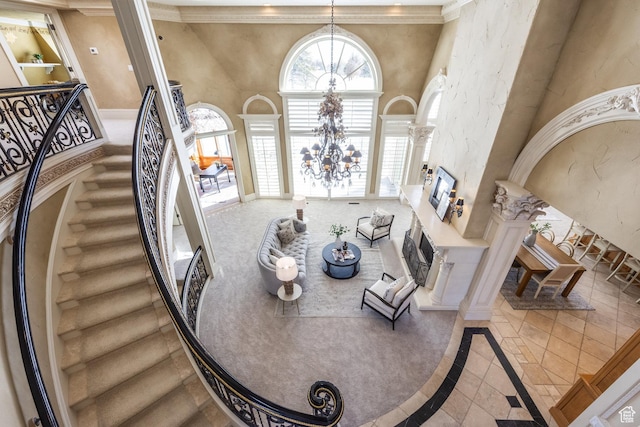 2726 E Wasatch Dr Unit 18, Salt Lake City, UT 84108 - interior space with baseboards, ornamental molding, decorative columns, a high ceiling, and a notable chandelier