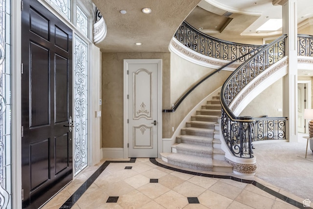2726 E Wasatch Dr Unit 18, Salt Lake City, UT 84108 - entrance foyer with baseboards, stairs, a textured ceiling, and recessed lighting