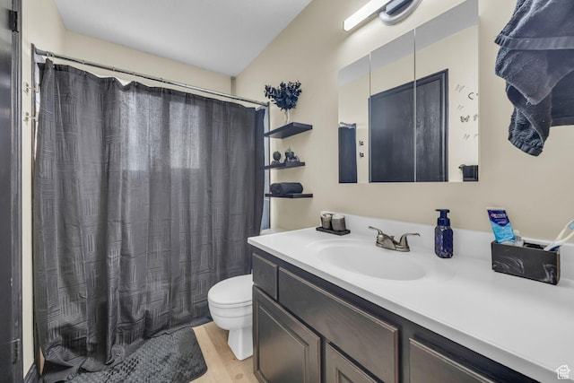 4933 S 3900 W, Roy, UT 84067 - bathroom with toilet, a shower with shower curtain, vanity, and wood finished floors