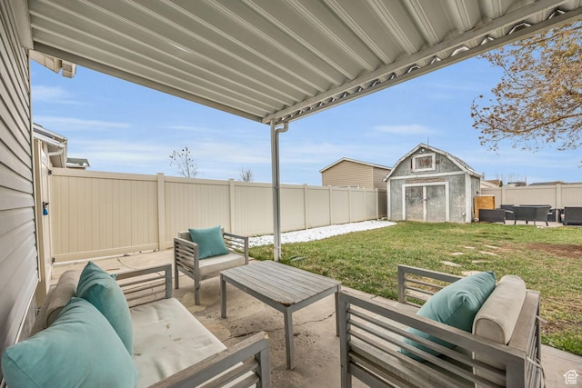 4933 S 3900 W, Roy, UT 84067 - view of patio with an outdoor living space, an outbuilding, a fenced backyard, and a shed