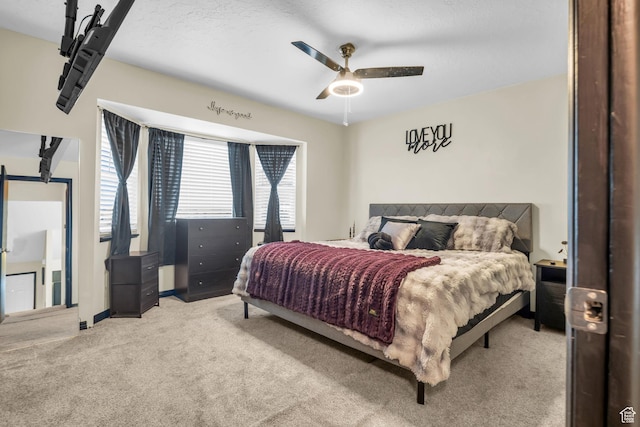4933 S 3900 W, Roy, UT 84067 - bedroom with a ceiling fan, light carpet, and baseboards