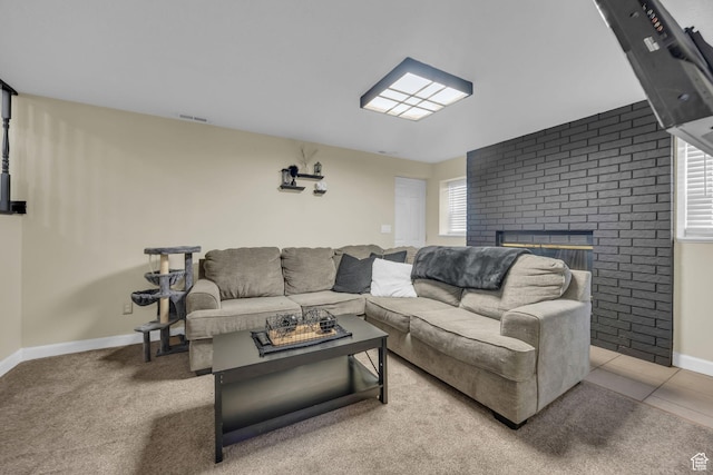 4933 S 3900 W, Roy, UT 84067 - tiled living room featuring baseboards, carpet floors, visible vents, and a brick fireplace