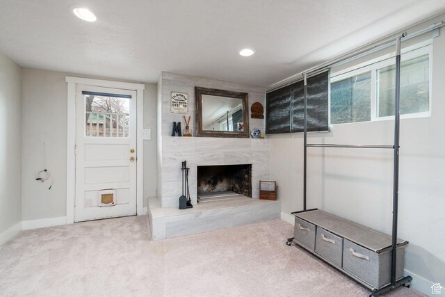 1305 N Valentine St, Salt Lake City, UT 84116 - living room with baseboards, a fireplace, recessed lighting, and carpet flooring