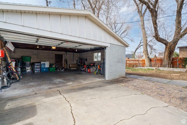 1305 N Valentine St, Salt Lake City, UT 84116 - garage with a garage door opener and fence