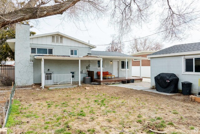 1305 N Valentine St, Salt Lake City, UT 84116 - back of house featuring a chimney, fence, central AC unit, and a porch
