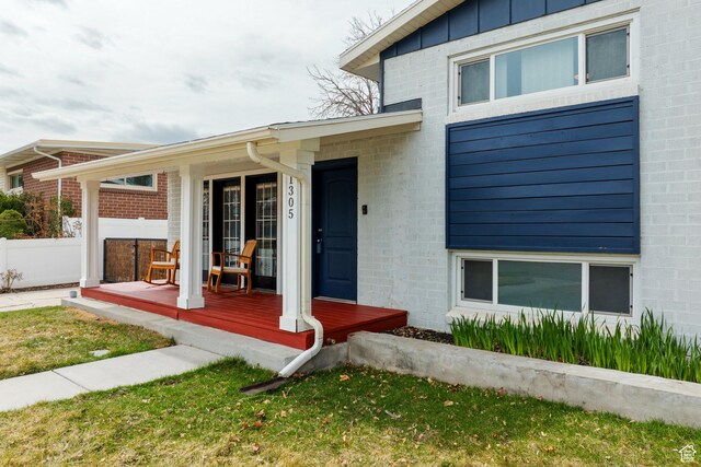 1305 N Valentine St, Salt Lake City, UT 84116 - view of exterior entry featuring covered porch and fence