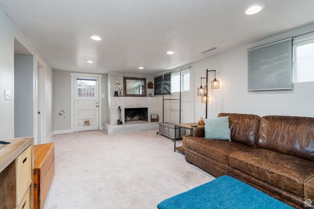 1305 N Valentine St, Salt Lake City, UT 84116 - living area featuring visible vents, light carpet, a fireplace, and recessed lighting