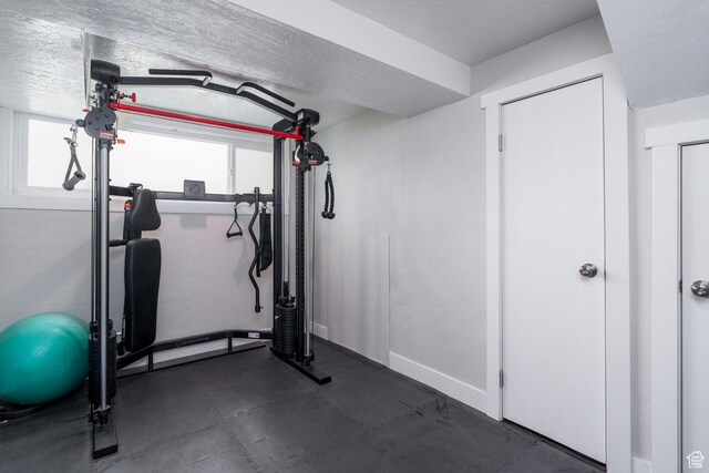 1305 N Valentine St, Salt Lake City, UT 84116 - workout area featuring baseboards and a textured ceiling