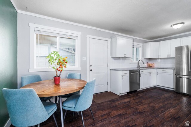 1305 N Valentine St, Salt Lake City, UT 84116 - kitchen featuring dark wood-style flooring, a sink, ornamental molding, and appliances with stainless steel finishes
