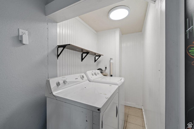 169 E 30th St S, Ogden, UT 84401 - laundry area with light tile patterned floors, a textured wall, washing machine and dryer, and laundry area