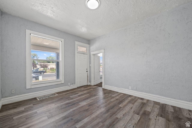 169 E 30th St S, Ogden, UT 84401 - entrance foyer featuring visible vents, wood finished floors, and a textured wall
