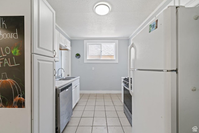 169 E 30th St S, Ogden, UT 84401 - kitchen with a textured ceiling, stainless steel appliances, white cabinetry, a sink, and light tile patterned floors