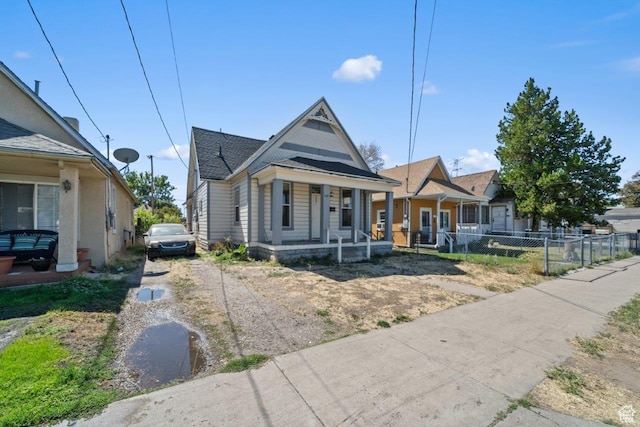 169 E 30th St S, Ogden, UT 84401 - view of front of home featuring driveway, fence, and a porch