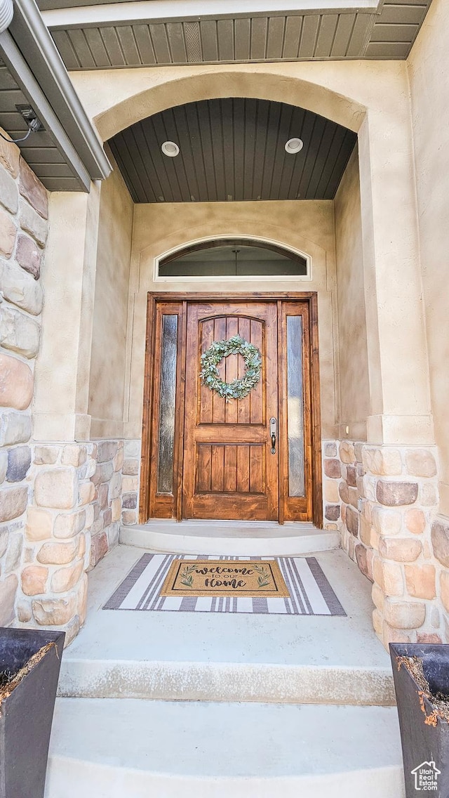 view of exterior entry with stone siding