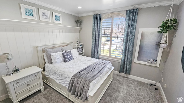 bedroom featuring crown molding, dark colored carpet, and baseboards