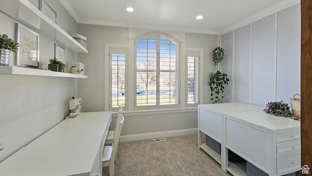 office space featuring plenty of natural light, crown molding, and baseboards