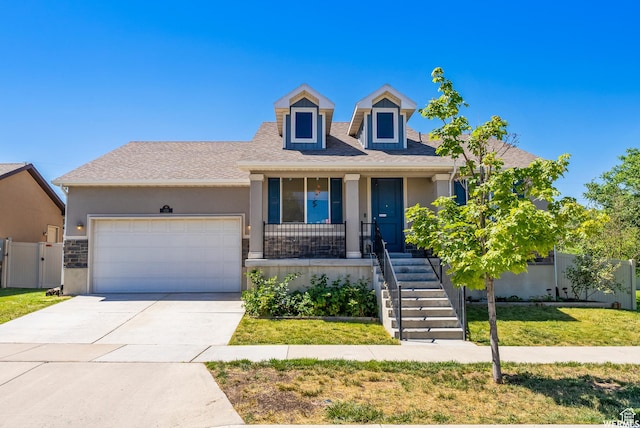 view of front of house with a garage, concrete driveway, a front lawn, stucco siding, and a porch