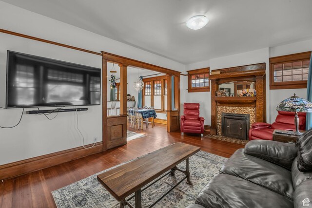 736 E 800 S, Salt Lake City, UT 84102 - living room with a fireplace with flush hearth, baseboards, wood finished floors, and an inviting chandelier