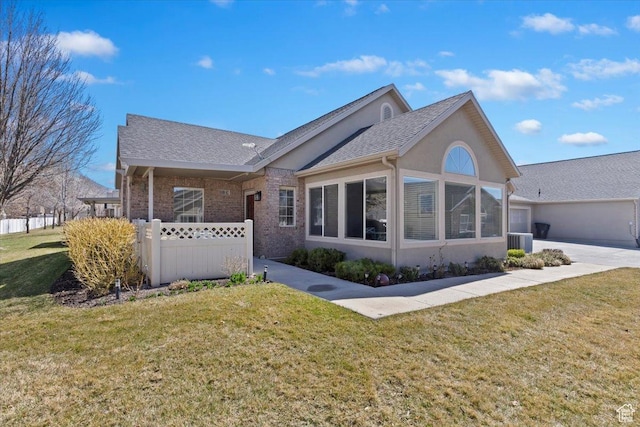 518 W 300 S Unit C, Springville, UT 84663 - exterior space featuring cooling unit, a sunroom, stucco siding, and a lawn