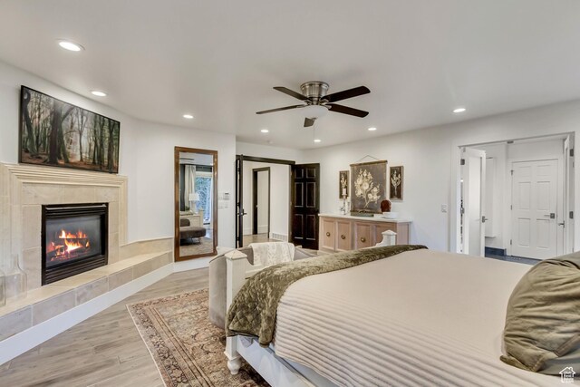 1448 E 155 S, Lindon, UT 84042 - bedroom with light wood-style flooring, a tile fireplace, and recessed lighting