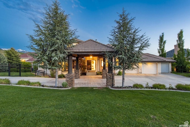 1448 E 155 S, Lindon, UT 84042 - view of front facade featuring a tile roof, fence, concrete driveway, and a front yard