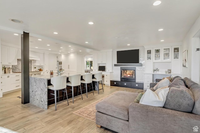 1448 E 155 S, Lindon, UT 84042 - living room featuring a fireplace, light wood-style flooring, and recessed lighting