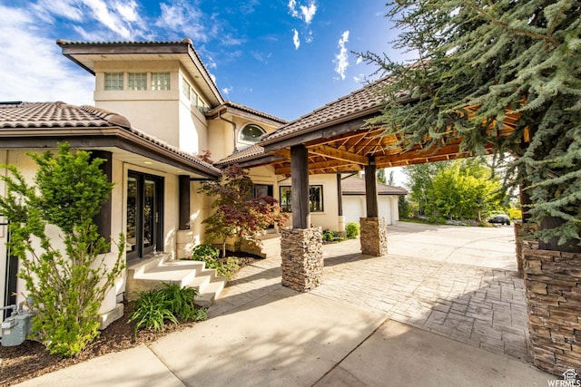 1448 E 155 S, Lindon, UT 84042 - view of patio with driveway, a garage, and french doors