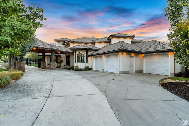 1448 E 155 S, Lindon, UT 84042 - view of front facade with a tiled roof, stucco siding, a garage, and driveway
