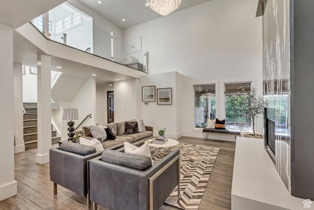 1448 E 155 S, Lindon, UT 84042 - living area featuring stairway, recessed lighting, baseboards, a high ceiling, and wood finished floors