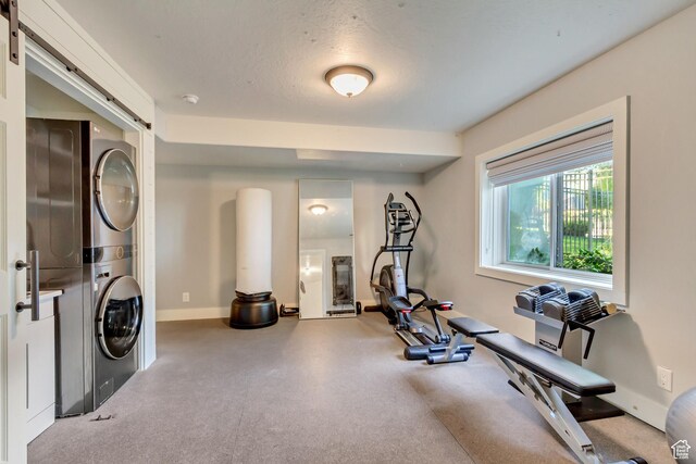 1448 E 155 S, Lindon, UT 84042 - exercise area with a textured ceiling, baseboards, and stacked washer / drying machine