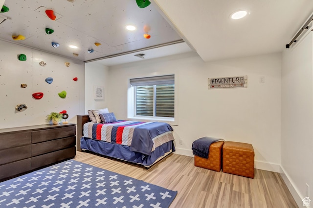 1448 E 155 S, Lindon, UT 84042 - bedroom with recessed lighting, baseboards, a barn door, visible vents, and wood finished floors