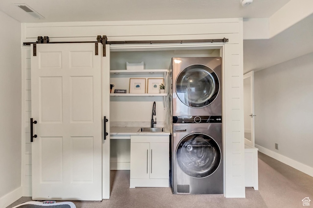 1448 E 155 S, Lindon, UT 84042 - laundry area featuring visible vents, baseboards, a sink, stacked washer and dryer, and cabinet space