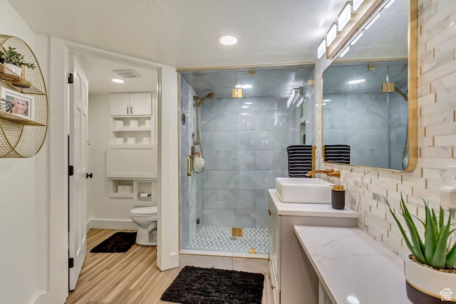 1448 E 155 S, Lindon, UT 84042 - full bath featuring toilet, vanity, a shower stall, wood finished floors, and visible vents