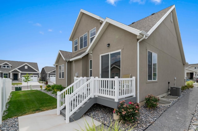 6606 N Furner Rdg, Eagle Mountain, UT 84005 - view of property exterior featuring stucco siding, a lawn, and a residential view
