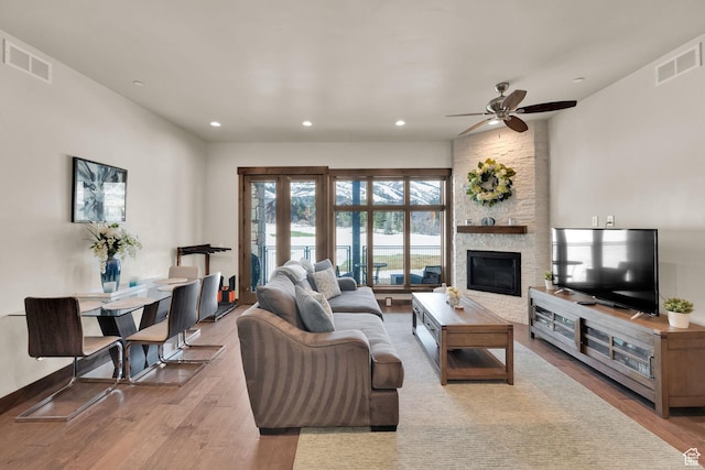 3793 Blackstone Dr Unit 2F, Park City, UT 84098 - living area with visible vents, wood finished floors, ceiling fan, and a fireplace
