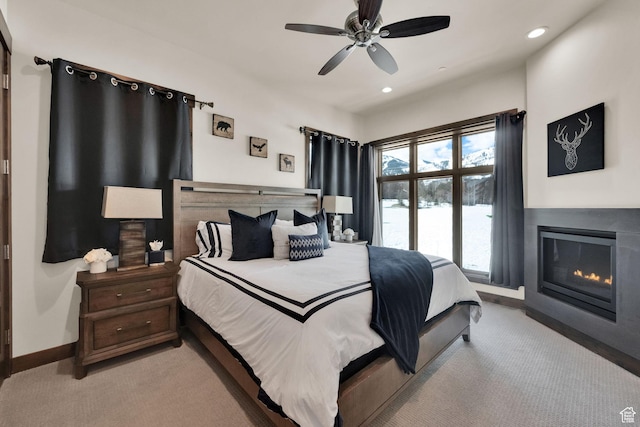 3793 Blackstone Dr Unit 2F, Park City, UT 84098 - bedroom featuring recessed lighting, baseboards, a ceiling fan, light carpet, and a glass covered fireplace