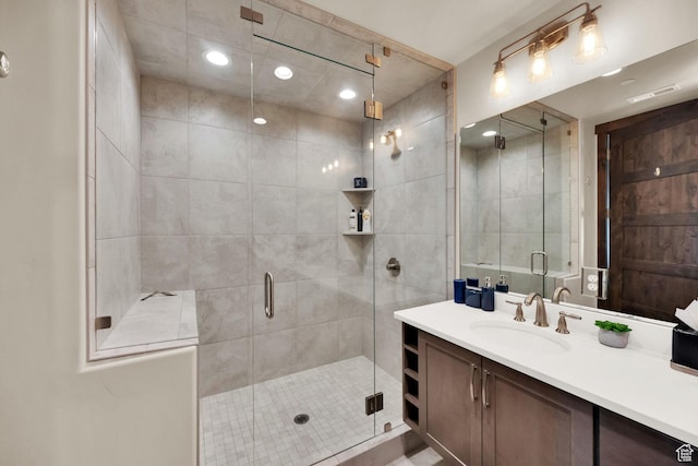 3793 Blackstone Dr Unit 2F, Park City, UT 84098 - bathroom with a shower stall, recessed lighting, and vanity