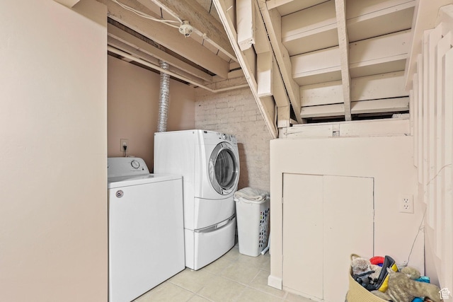 427 E 1st Ave, Salt Lake City, UT 84103 - clothes washing area with washing machine and clothes dryer, light tile patterned floors, and laundry area