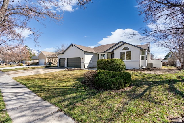ranch-style house with stucco siding, concrete driveway, a front lawn, and an attached garage