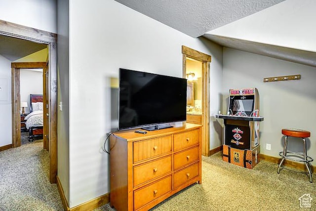 3518 N Moose Hollow Dr, Eden, UT 84310 - living area with light carpet, baseboards, lofted ceiling, and a textured ceiling