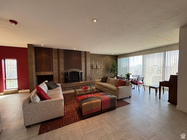245 N Vine St W Unit 903, Salt Lake City, UT 84103 - living area with a textured ceiling, a fireplace, baseboards, and recessed lighting