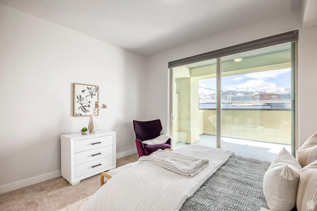 6169 Park S Unit 20, Park City, UT 84098 - bedroom with light colored carpet, access to exterior, and baseboards