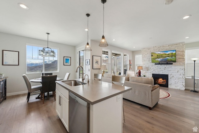 6065 N Westridge Rd, Heber City, UT 84032 - kitchen with a sink, stainless steel dishwasher, wood finished floors, and a healthy amount of sunlight