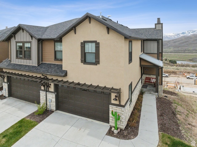 6065 N Westridge Rd, Heber City, UT 84032 - view of front facade with a garage, board and batten siding, stone siding, and concrete driveway